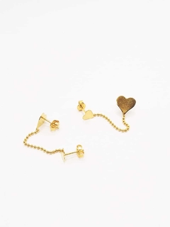 Aros doble corazón laminado en oro 18k.