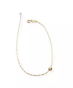 Tobillera laminada en oro 18k con dije esfera.