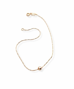 Tobillera laminada en oro 18k con dije esfera. - comprar online
