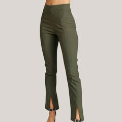 Calza de bengalina elastizada corte Oxford para mujer en color verde con aberturas en la parte inferior.