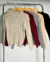Sweater con trenzas