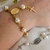 Pulseira Nossa Senhora e Cruz na internet