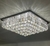 Lustre plafon quadrado transparente da Linha Cristal Harion, com acabamento brilhante e detalhes em cristal.