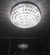 Lustre plafon da Linha Cristal Harion em formato redondo com acabamento em âmbar, iluminando o ambiente.