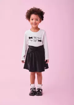 Conjunto de blusa com detalhes de laços e saia aveludada na internet
