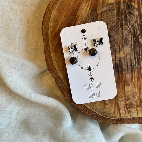 Brinco Olho de Tigre Bolinha Borboleta prateada - Joias que Curam