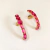 Brinco Meia Argola com Cristais Fúcsia Oval – Banhado a Ouro 18k - comprar online