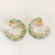 BRINCO MEIA ARGOLA CRISTAIS VERDES COM ZIRCÔNIA NO OURO 18K