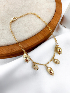 Pulseira folheada a ouro 18k e prata 925 de pingente de esferas.