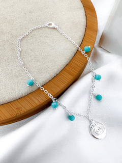 Pulseira folheada a ouro 18k e prata 925 de pedras azuis e olho grego. - comprar online