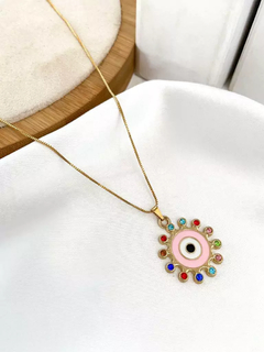 Veneziana folheada a ouro com olho esmaltado e detalhe colorido. na internet