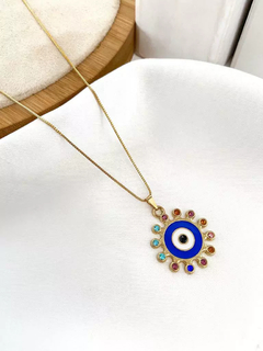 Veneziana folheada a ouro com olho esmaltado e detalhe colorido. - comprar online