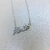 Nombre en plata con detalle en oro y cadena