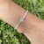 Pulsera tennis con un susanito en Plata 925 y cubics