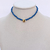 Colar Miçanga Azul c/coração Dourado - comprar online