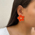 Brinco Flor Laranja Esmaltado na internet
