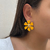 Brinco Flor Amarela Esmaltada na internet
