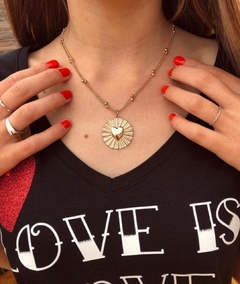 Collar dorado con cadena doble y dije de corazón - comprar online
