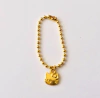Pingente dourado - Hello Kitty