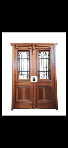 Puerta de entrada Cedro,molduras y rejas trabajada - comprar online
