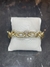 Pulseira dourada cravejada na internet