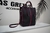 Bolso negro con rosa