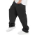 Calça oversized preta em sarja, modelo XXL, com bolsos e estilo casual.