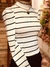 POLERA BLANCA CON RAYAS NEGRAS