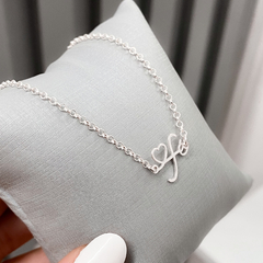PULSEIRA COM PINGENTE FE DE PRATA na internet