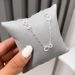 PULSEIRA COM TRES INFINITOS LISOS DE PRATA - comprar online