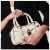 BOLSA PEQUENA EM COURO OFF WHITE COM CADEADO DECORATIVO - comprar online