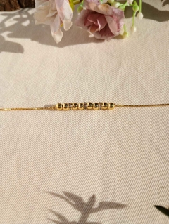 Pulseira com detalhe de bolinha na internet