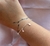 pulseira estrelas prata