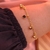 Pulseira pedrinhas preta dourada