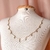 Chocker cruz dourada
