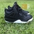 Tênis Nike Air Jordan 4 Retrô / preto e branco 