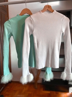 Blusa plumas modal