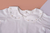 Detalle cuello body algodón pima peruano 