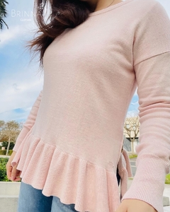 Sweater rosa con cierres en internet
