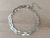 PULSERA DE ACERO VÍBORA CHATA TRIPLE ENTRELAZADA. LARGO 18,5 CM + EXT. 5 CM.