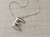 DIJE DE ACERO INICIAL E DE 15 X 20 MM CON CADENA CLAPTON CON BOLITAS DE 40 CM + EXT. DE 5 CM