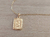 DIJE DE ACERO DORADO MEDALLA RECTANGULAR TRABAJADA EN RELIEVE CON INICIAL «S» Y CADENA ESPEJITO X 45 CM. TAMAÑO 15 X 20 MM