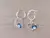 ARO DE ACERO BLANCO ARGOLLA 14 MM CON DIJE CORAZÓN CON STRASS BLANCO Y OJO TURCO AZUL