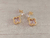 ARO DE ACERO DORADO CUBIK CRISTAL CON DIJE VAN CLEEF COLOR ROSA. LARGO 21 MM.