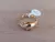 ANILLO DE ACERO DORADO VÍBORA ESLABÓN GRUMET OJOS STRASS VERDE