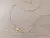 COLGANTE DE ACERO DORADO CADENA COLA DE RATÓN CON BOLITAS 3 MM Y DIJE PASANTE ESTRELLA. LARGO 35 + 5 CM EXT.