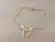 PULSERA DE ACERO DORADO ESLABÓN ESPEJITO CON CENTRO MOÑO. LARGO 18,5 CM