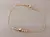 PULSERA DE ACERO DORADO ESLABÓN COLA DE RATÓN CON BOLITAS DE 3 MM Y ESTRELLA CENTRAL. LARGO 18,5 CM