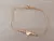 PULSERA DE ACERO DORADO ESLABÓN COLA DE RATÓN CON BOLITAS DE 3 MM Y CORAZÓN CHICO CENTRAL. LARGO 19 CM