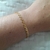 Pulseira de coração com tracinho vazado folheada a ouro 18k